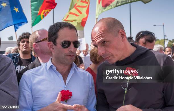 Former Greek Finance Minister Yanis Varoufakis and former French Socialist Party member and founder of Génération-s Benoit Hamon chat before walking...