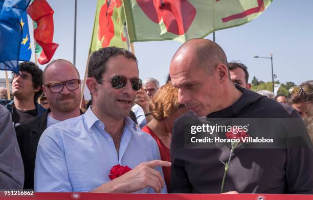 Former Greek Finance Minister Yanis Varoufakis and former French Socialist Party member and founder of Génération-s Benoit Hamon chat before walking...