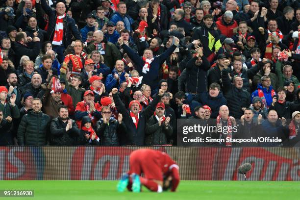 Liverpool fans react as Mohamed Salah of Liverpool celebrates after scoring their 1st goal during the UEFA Champions League Semi Final First Leg...