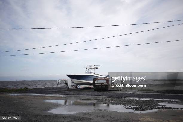 Fishing boat sits on a trailer in Grand Isle, Louisiana, U.S., on Friday, March 30, 2018. In Louisiana, the combination of rising seas, subsiding...