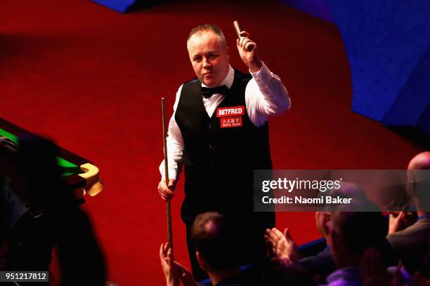 John Higgins of Scotland celebrates after winning his first round match against Thepchaiya Un-Nooh of Thailand during day five of the World Snooker...