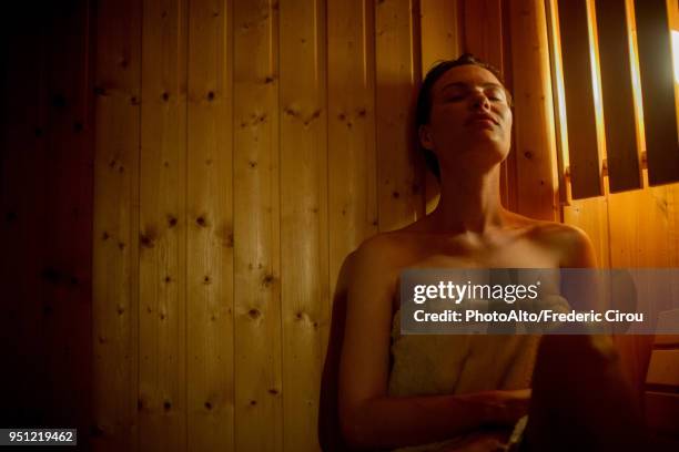 woman relaxing in sauna - sauna ストックフォトと画像