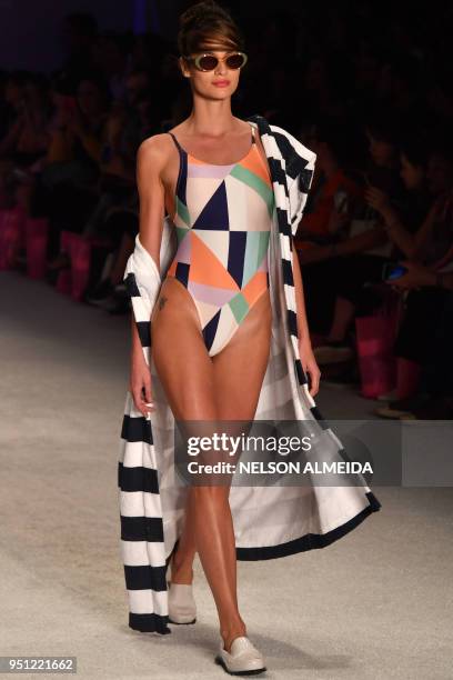 Model presents a creation by Salinas during the Sao Paulo Fashion Week in Sao Paulo, Brazil on April 25, 2018.
