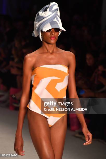 Model presents a creation by Salinas during the Sao Paulo Fashion Week in Sao Paulo, Brazil on April 25, 2018.
