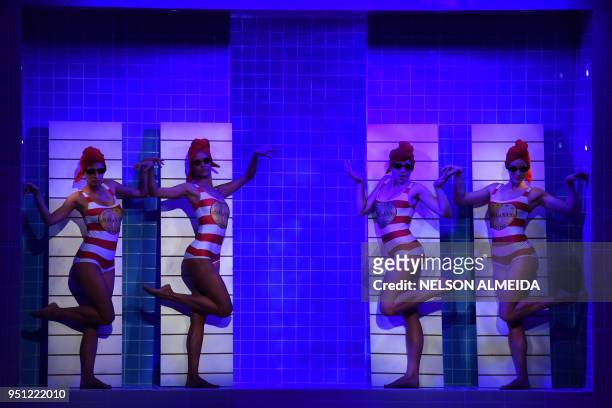 Models present creations by Salinas during the Sao Paulo Fashion Week in Sao Paulo, Brazil on April 25, 2018.