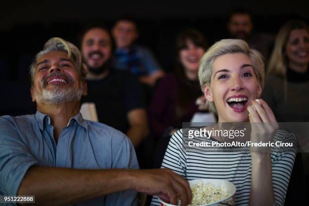 couple watching movie together - romance film stock-fotos und bilder