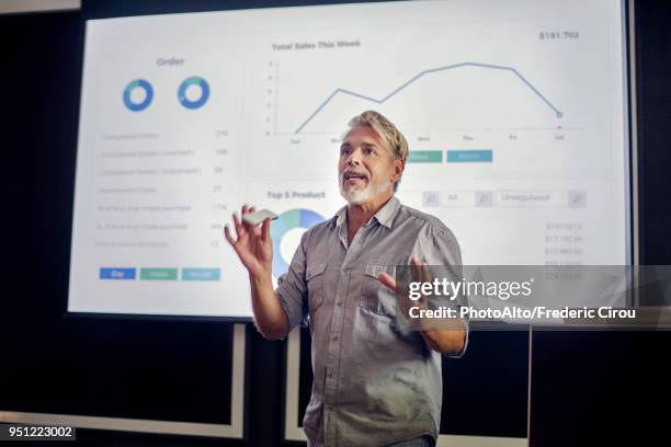 man giving presentation - teacher meeting stock pictures, royalty-free photos & images