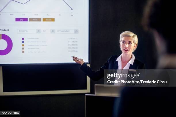 woman giving presentation - multimedia presentation stock pictures, royalty-free photos & images