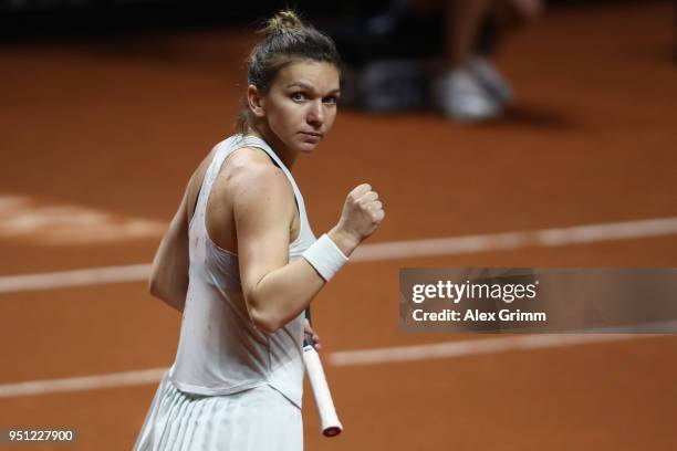 Simona Halep of Romania celebrates after defeating Magdalena Rybarikova of Slovakia during day 3 of the Porsche Tennis Grand Prix at Porsche-Arena on...