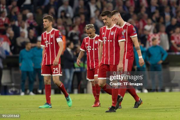 Thomas Mueller of Bayern Muenchen , Rafinha of Bayern Muenchen and Robert Lewandowski of Bayern Muenchen looks dejected after the UEFA Champions...