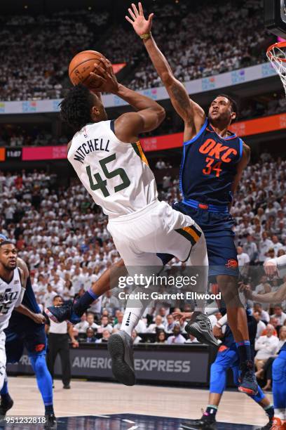 Donovan Mitchell of the Utah Jazz shoots the ball against Josh Huestis of the Oklahoma City Thunder in Game Four of Round One of the 2018 NBA...