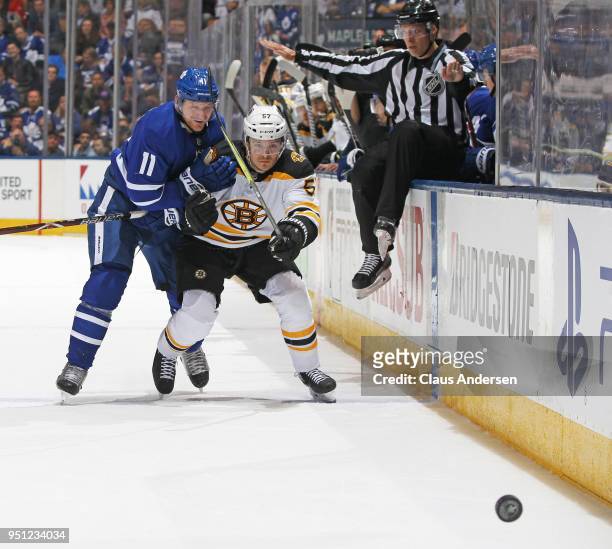 Tommy Wingels of the Boston Bruins battles against Zach Hyman of the Toronto Maple Leafs in Game Six of the Eastern Conference First Round in the...