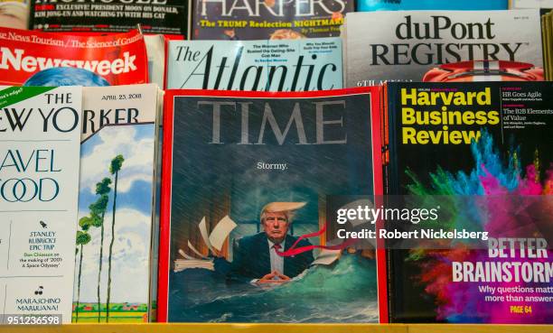 Recent copy of TIME magazine sits in a rack at a Hudson News bookstore April 21, 2018 at John F. Kennedy International Airport in the Queens borough...