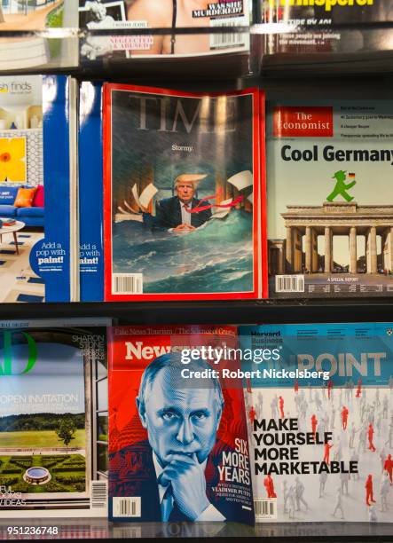 Recent copies of TIME and Newsweek magazines sit in a rack at a Hudson News bookstore April 23, 2018 at Raleigh International Airport in Raleigh,...