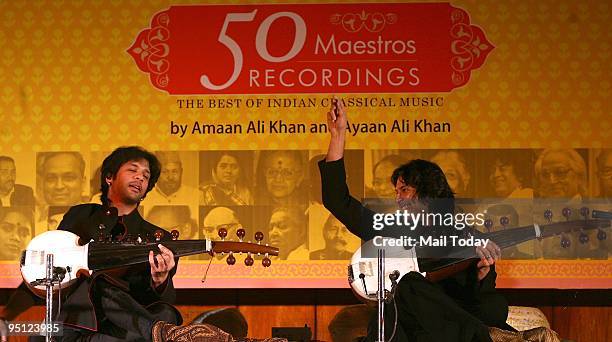 Sarod players Amaan and Ayaan Ali Khan vibe on the stage during the sarod recital that marked the launch of the book 50 Maestros 50 Recordings in New...