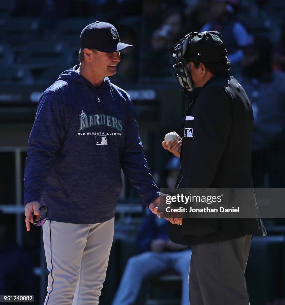 Manager Scott Servais of the Seattle Mariners argues with honme plate umpire Alfonso Marquez during a game against the Chicago White Sox at...