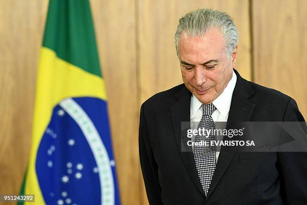Brazilian President Michel Temer gestures during new ambassadors' presentation of credentials ceremony at Planalto Palace in Brasilia on April 25,...