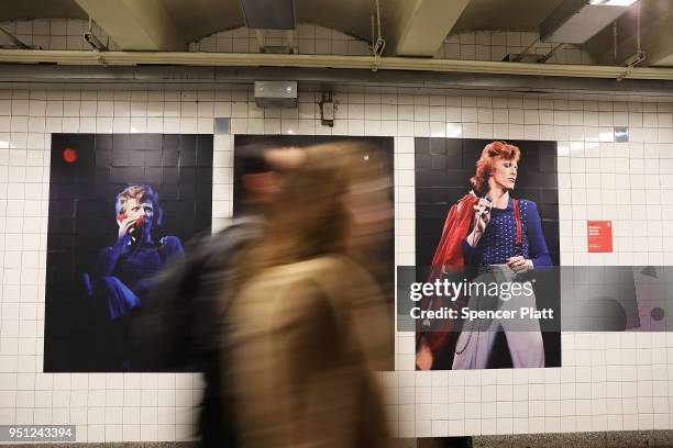 Pictures of rock legend Davis Bowie line the walls of a New York City subway station on April 25, 2018 in New York City. Besides concert photos and...