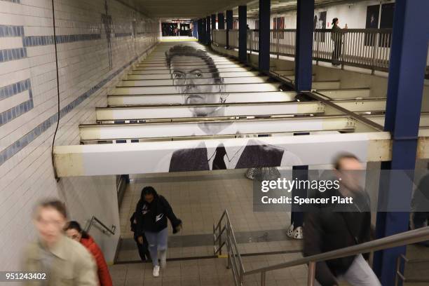 Pictures of rock legend Davis Bowie line the walls of a New York City subway station on April 25, 2018 in New York City. Besides concert photos and...