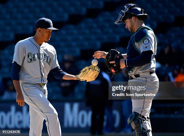 Seattle Mariners relief pitcher Edwin Diaz receive the ball from Seattle Mariners catcher Mike Zunino during the game against the Chicago White Sox...