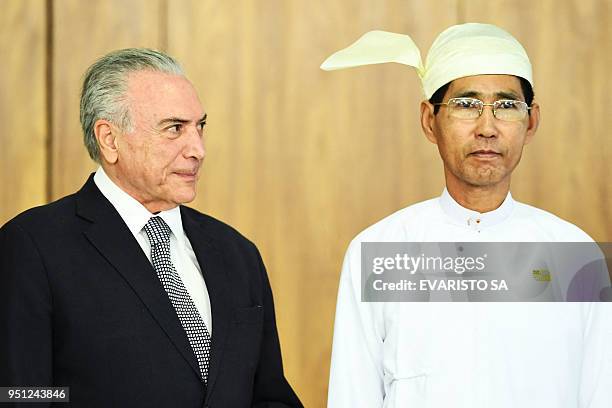 Brazilian President Michel Temer and Myanmar's Ambassador Myo Tint pose for pictures during new ambassadors' presentation of credentials ceremony at...
