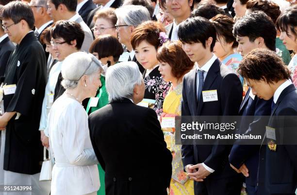 Emperor Akihito, Empress Michiko talk with Olympic gold medalist Yuzuru Hanyu during the spring garden party at the Akasaka Imperial Garden on April...