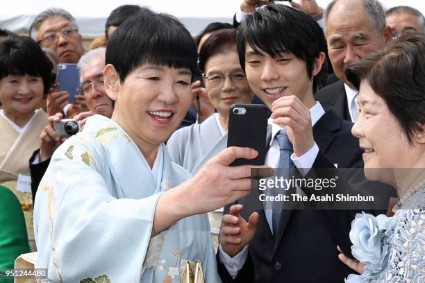 Olympic gold medalist Yuzuru Hanyu takes selfie with singer Akiko Wada during the spring garden party at the Akasaka Imperial Garden on April 25,...