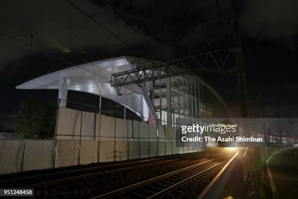 Train runs past the crash site on April 25, 2018 in Amagasaki, Hyogo, Japan. The worst train accident in 40 years killed 107 people and injured 562,...