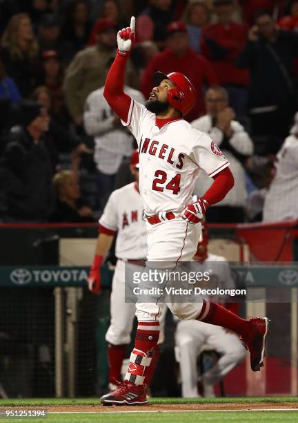 Chris Young of the Los Angeles Angels of Anaheim points to the sky as he approaches home plate after hitting a solo homerun in the fifth inning...