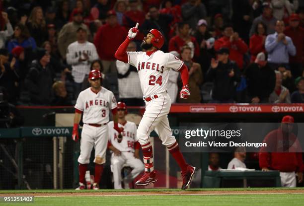 Chris Young of the Los Angeles Angels of Anaheim points to the sky as he approaches home plate after hitting a solo homerun in the fifth inning...