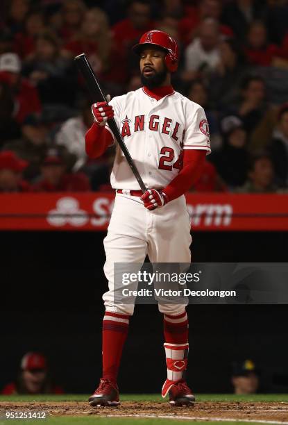 Chris Young of the Los Angeles Angels of Anaheim checks his bat in the second inning during the MLB game against the Boston Red Sox at Angel Stadium...