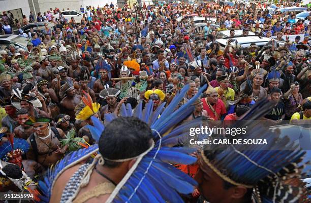 Brazilian indigenous people gather during a protest against the government's decision not to recognize the land demarcation of indigenous people...