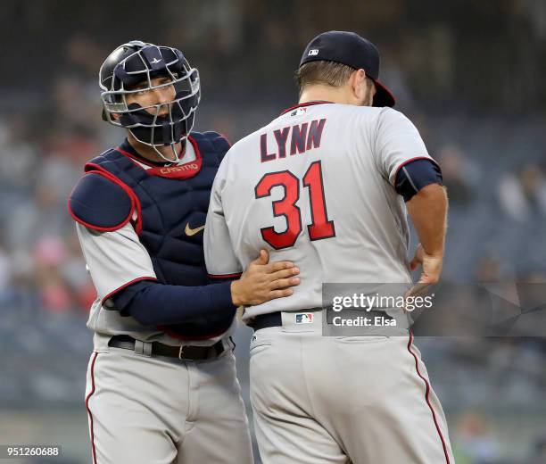 Jason Castro of the Minnesota Twins talks with Lance Lynn in the first inning against the New York Yankees at Yankee Stadium on April 25, 2018 in the...