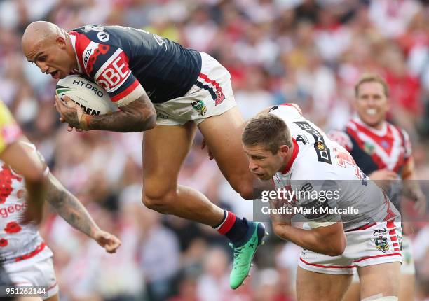 Blake Ferguson of the Roosters is tackled in the air during the round eight NRL match between the St George Illawara Dragons and Sydney Roosters at...