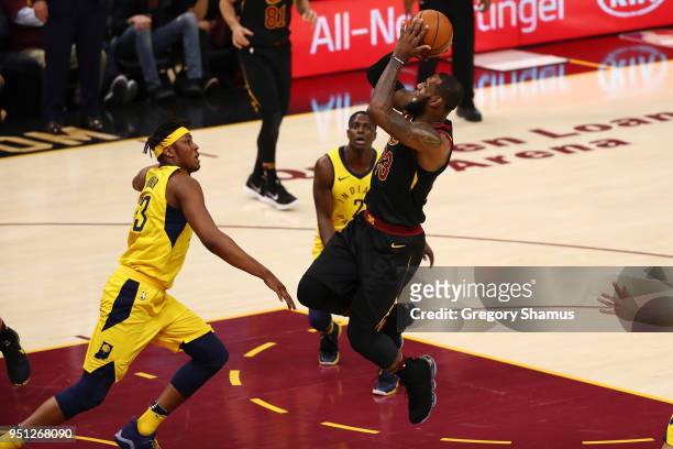 LeBron James of the Cleveland Cavaliers tries to get off a first half shot over Myles Turner of the Indiana Pacers in Game Five of the Eastern...
