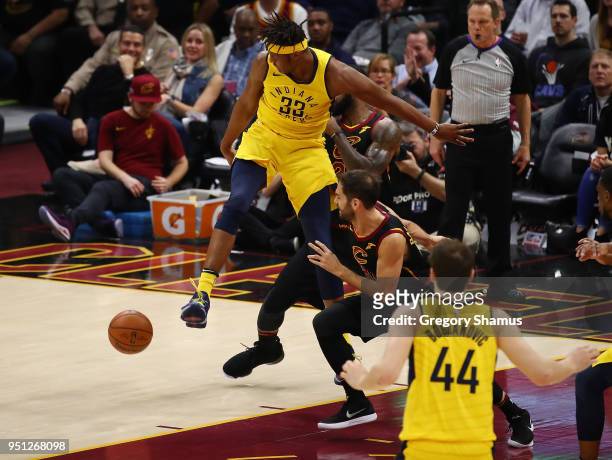 Myles Turner of the Indiana Pacers loses control of the ball next to Jose Calderon of the Cleveland Cavaliers during the first half of Game Five of...
