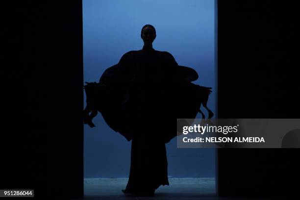 Model presents a creation by Lino Villaventura during the Sao Paulo Fashion Week in Sao Paulo, Brazil on April 25, 2018.
