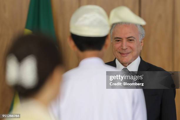 Michel Temer, Brazil's president, smiles while receiving Myo Tint, Myanmar's ambassador to Brazil, during a ceremony of accreditation at the Planalto...