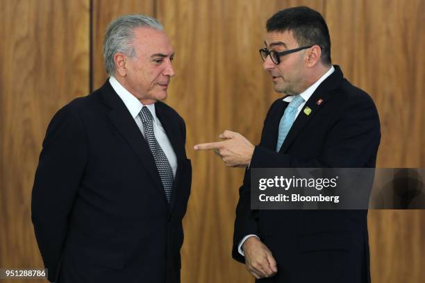 Michel Temer, Brazil's president, left, speaks with Andrea Semadeni, Switzerland's ambassador to Brazil, during a ceremony of accreditation at the...