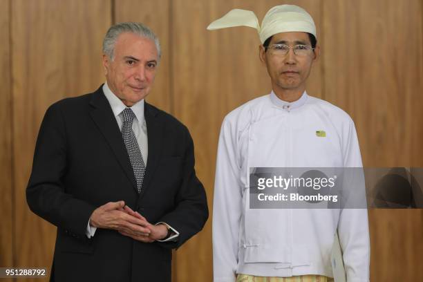 Michel Temer, Brazil's president, left, and Myo Tint, Myanmar's ambassador to Brazil, stand for a photograph during a ceremony of accreditation at...