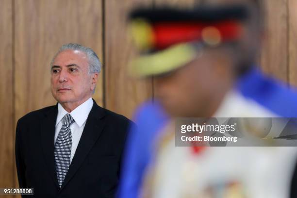 Michel Temer, Brazil's president, listens during a ceremony of accreditation at the Planalto Palace in Brasilia, Brazil, on Wednesday, April 25,...