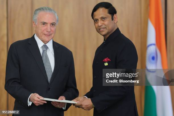 Michel Temer, Brazil's president, left, and Ashok Das, India's ambassador to Brazil, stand for a photograph during a ceremony of accreditation at the...