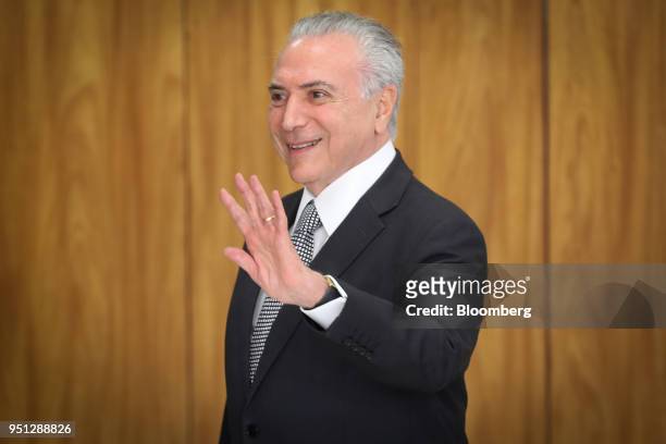 Michel Temer, Brazil's president, waves while leaving a ceremony of accreditation at the Planalto Palace in Brasilia, Brazil, on Wednesday, April 25,...