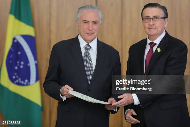 Michel Temer, Brazil's president, left, and Diego Antonio Rivadeneira Espinosa, Ecuador's ambassador to Brazil, stand for a photograph during a...