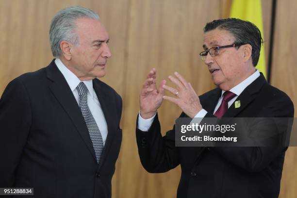 Michel Temer, Brazil's president, left, speaks with Diego Antonio Rivadeneira Espinosa, Ecuador's ambassador to Brazil, during a ceremony of...