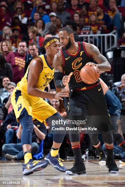 LeBron James of the Cleveland Cavaliers handles the ball against Myles Turner of the Indiana Pacers in Game Five of Round One of the 2018 NBA...