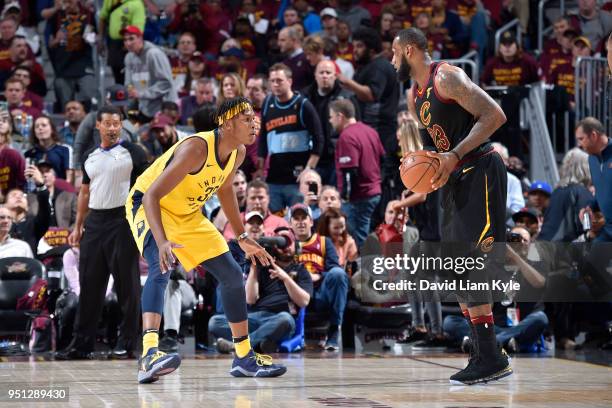 LeBron James of the Cleveland Cavaliers handles the ball against Myles Turner of the Indiana Pacers in Game Five of Round One of the 2018 NBA...