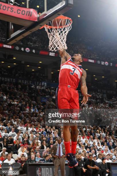 Bradley Beal of the Washington Wizards dunks the ball against the Toronto Raptors in Game Five of the Eastern Conference Quarterfinals during the...