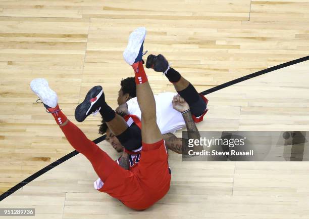 Toronto Raptors guard Kyle Lowry and Washington Wizards forward Kelly Oubre Jr. Get tangled up as the Toronto Raptors play game five of their first...