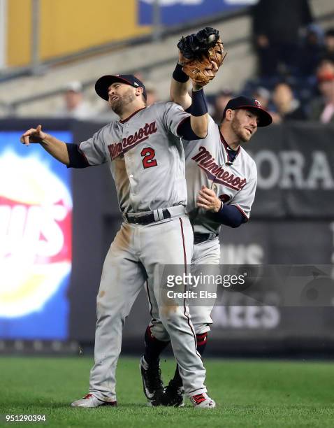 Robbie Grossman of the Minnesota Twins makes the catch for the out as he collides with teamamte Brian Dozier in the fourth inning against the New...